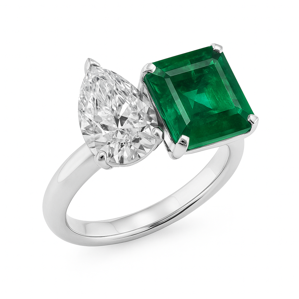 Pear diamond and emerald cut emerald Toi et Moi ring in 18K white gold by Irdoja Diamonds.