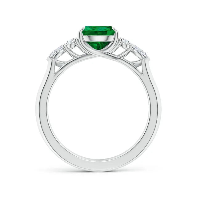Pear shape lab-grown emerald engagement ring with diamond side stones in 18k white gold by Irdoja Diamonds.