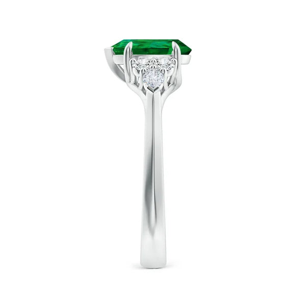 Lab-grown emerald three-stone engagement ring in 18K white gold by Irdoja Diamonds.