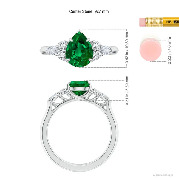 Lab-grown pear emerald three stone engagement ring in 18k white gold with side diamonds by Irdoja Diamonds.