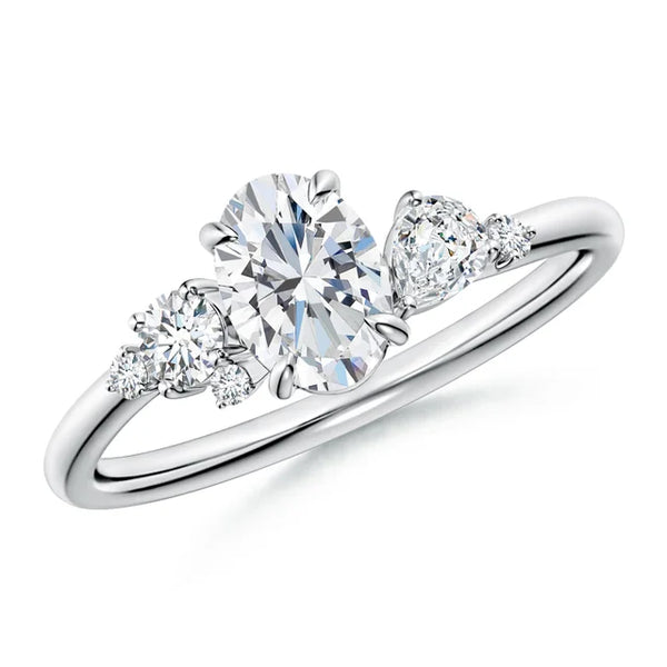 Claw prong oval lab-grown diamond engagement ring in 18k white gold with multi-shape diamond accents.
