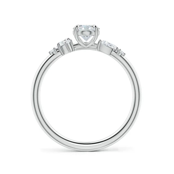 Claw prong oval lab-grown diamond engagement ring with multi-shape accents in 18k white gold.