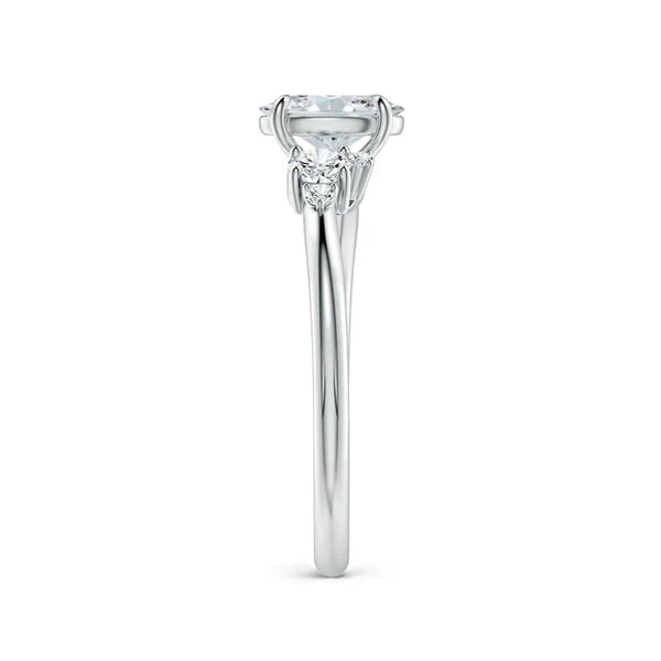 Oval lab-grown diamond ring with pear and round accents in 14K white gold by Irdoja Diamonds.