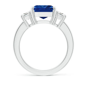 Emerald-cut blue sapphire three stone ring in 14K white gold by Irdoja Diamonds.