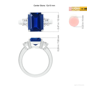 Emerald-cut blue sapphire three stone ring in 18K white gold by Irdoja Diamonds, featuring a 12x10 mm center stone.
