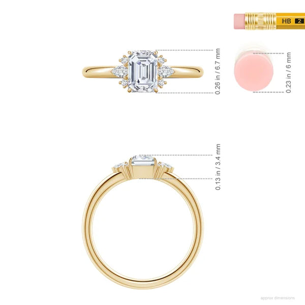 Emerald-cut lab diamond ring in 14K yellow gold with four-prong side stones by Irdoja Diamonds.