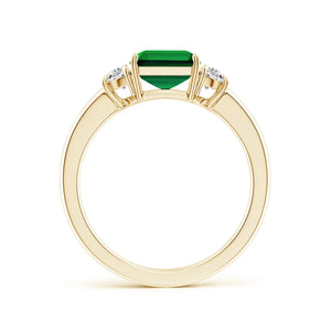 Emerald-cut lab-grown emerald three-stone ring with half moon diamonds in yellow gold by Irdoja Diamonds.