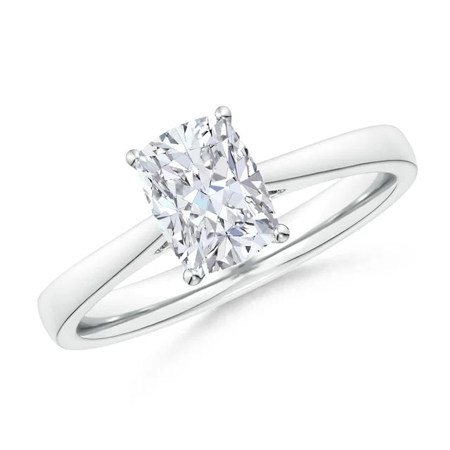 Lab-grown cushion diamond cathedral engagement ring with a tapered 14k gold band by Irdoja Diamonds.