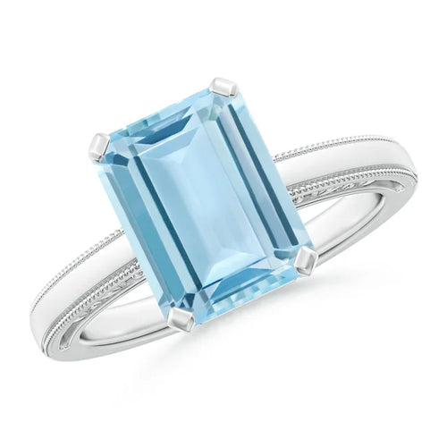 Emerald-cut aquamarine solitaire engagement ring with milgrain detailing by Irdoja Diamonds.