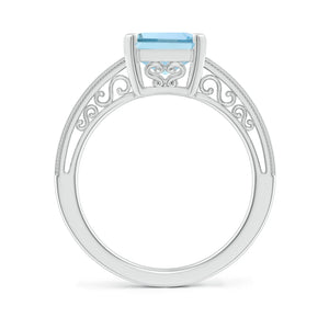 Emerald-cut aquamarine solitaire engagement ring with milgrain detailing in silver by Irdoja Diamonds.