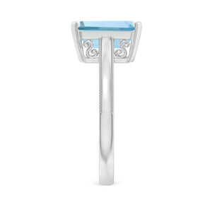 Emerald-cut aquamarine solitaire ring with milgrain details in 14K white gold by Irdoja Diamonds.