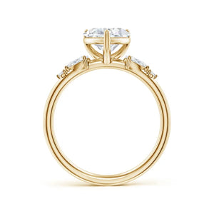 Prong-set heart-shaped lab-grown diamond engagement ring in yellow gold with side stones by Irdoja Diamonds.