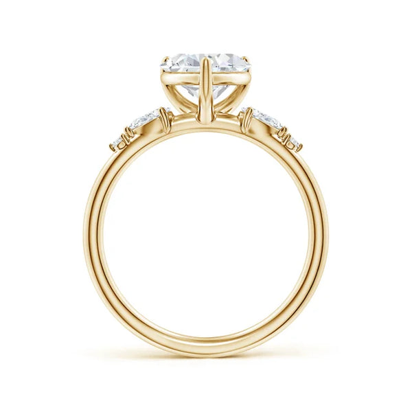 Prong-set heart-shaped lab-grown diamond engagement ring in yellow gold with side stones by Irdoja Diamonds.