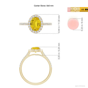 Prong-set oval yellow sapphire halo ring with diamond accents in 14k gold by Irdoja Diamonds.