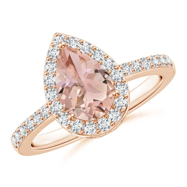 Prong-set pear morganite ring with diamond halo in rose gold by Irdoja Diamonds.