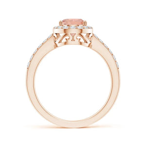 Prong-set pear morganite ring with diamond halo in rose gold by Irdoja Diamonds.