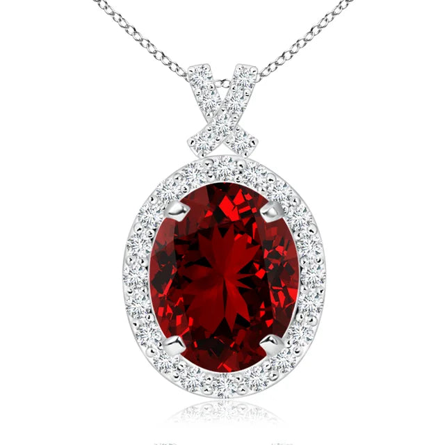 Lab-grown ruby pendant with 3.6ct oval gem, diamond halo, and 14K white gold chain by Irdoja Diamonds.