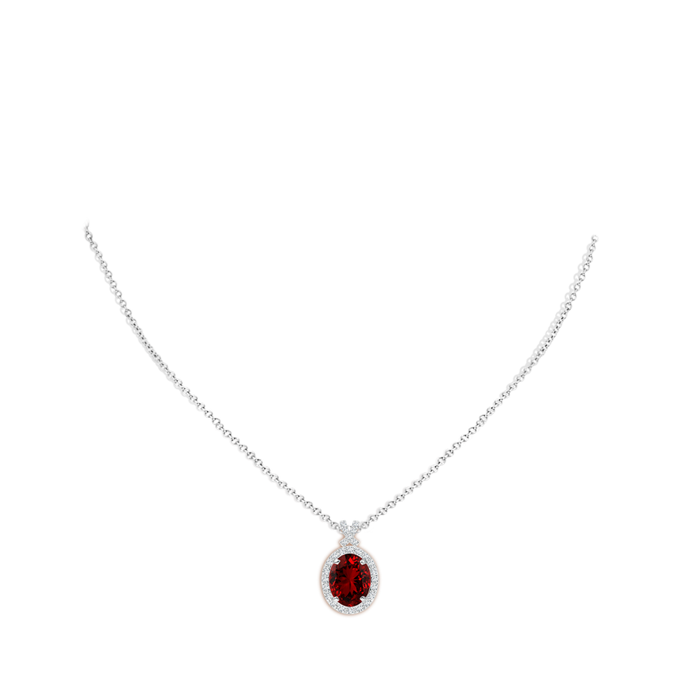 Lab-grown ruby pendant with 3.6ct oval gem, diamond halo, and 14K white gold chain by Irdoja Diamonds.