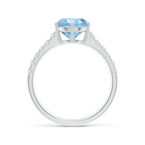 Natural aquamarine solitaire engagement ring with diamond accents in 18K white gold by Irdoja Diamonds.