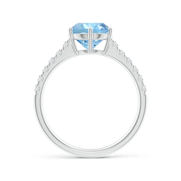 Natural aquamarine solitaire engagement ring with diamond accents in 18K white gold by Irdoja Diamonds.