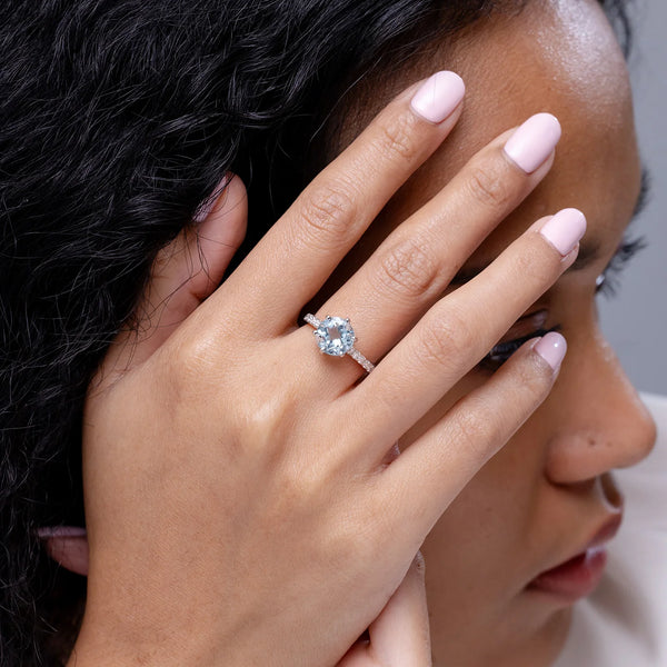 Natural aquamarine solitaire engagement ring with diamond accents in 14K or 18K gold by Irdoja Diamonds.