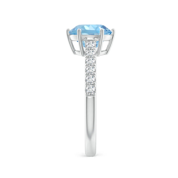 Natural aquamarine solitaire engagement ring with diamond accents in 18K white gold by Irdoja Diamonds.
