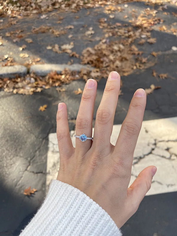 Natural aquamarine solitaire engagement ring with diamond accents in 14K or 18K gold by Irdoja Diamonds.