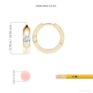 Channel-set round diamond huggie hoop earrings in 18K yellow gold from Irdoja Diamonds.