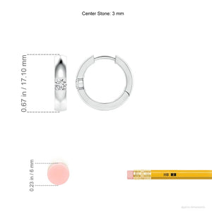 Channel-set round diamond huggie hoop earrings in 18K white and yellow gold by Irdoja Diamonds.