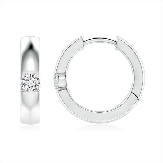 Channel-set round diamond huggie hoop earrings in 18k yellow gold by Irdoja Diamonds.