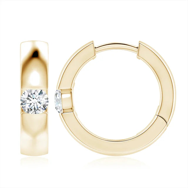 Channel-set round diamond huggie hoop earrings in 18k yellow gold by Irdoja Diamonds.