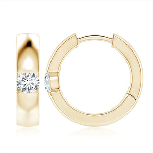 Channel-set round diamond huggie hoop earrings in 18k yellow gold by Irdoja Diamonds.