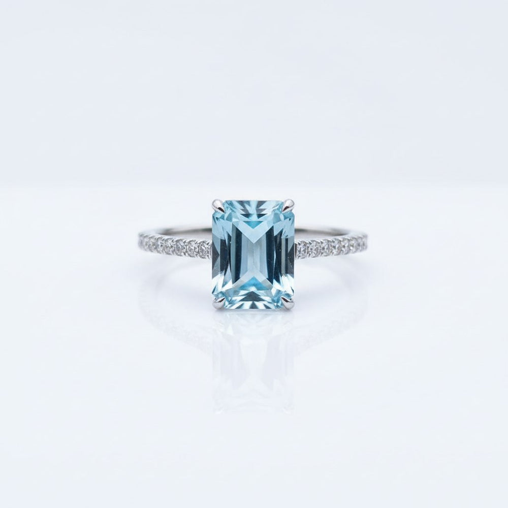 Emerald-Cut Aquamarine Ring with Diamond Band showcasing icy-blue clarity and elegant design.