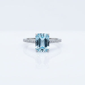 Emerald-Cut Aquamarine Ring with Diamond Band showcasing icy-blue clarity and elegant design.