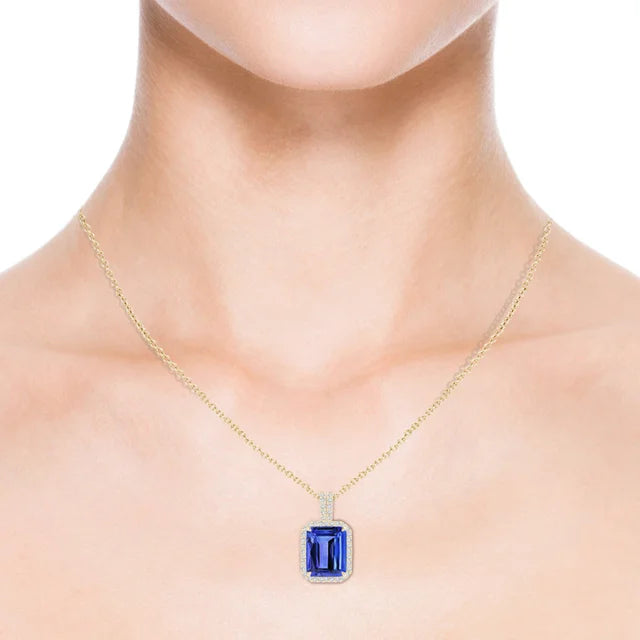 3.4ct Emerald-Cut Tanzanite Halo Pendant 18K Gold AAA Quality with diamond accents and vivid blue-violet coloring.