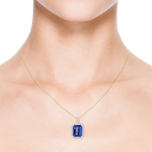 3.4ct Emerald-Cut Tanzanite Halo Pendant 18K Gold AAA Quality displayed on a model's neck, showcasing vivid blue-violet color.