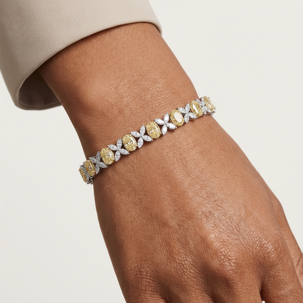 Fancy Yellow & White Lab Diamond Bracelet set in 18K gold, featuring oval-cut yellow and marquise-cut white lab diamonds.
