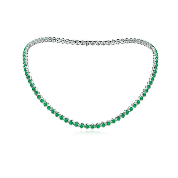 Hexagon emerald tennis necklace in 18K gold, featuring 8-carat AAA emeralds set in a delicate bezel design.