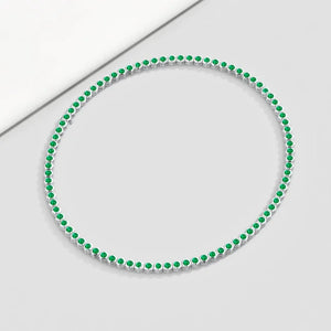 Hexagon Emerald Tennis Necklace - 14K/18K Gold Bezel Set featuring 80-90 AAA-quality round emeralds in hexagonal settings.