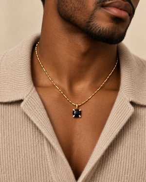 Bloom amulet necklace in black onyx, worn