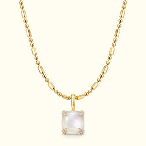 Bloom amulet necklace, a mother-of-pearl pendant on a 14K yellow gold ball-and-bar chain