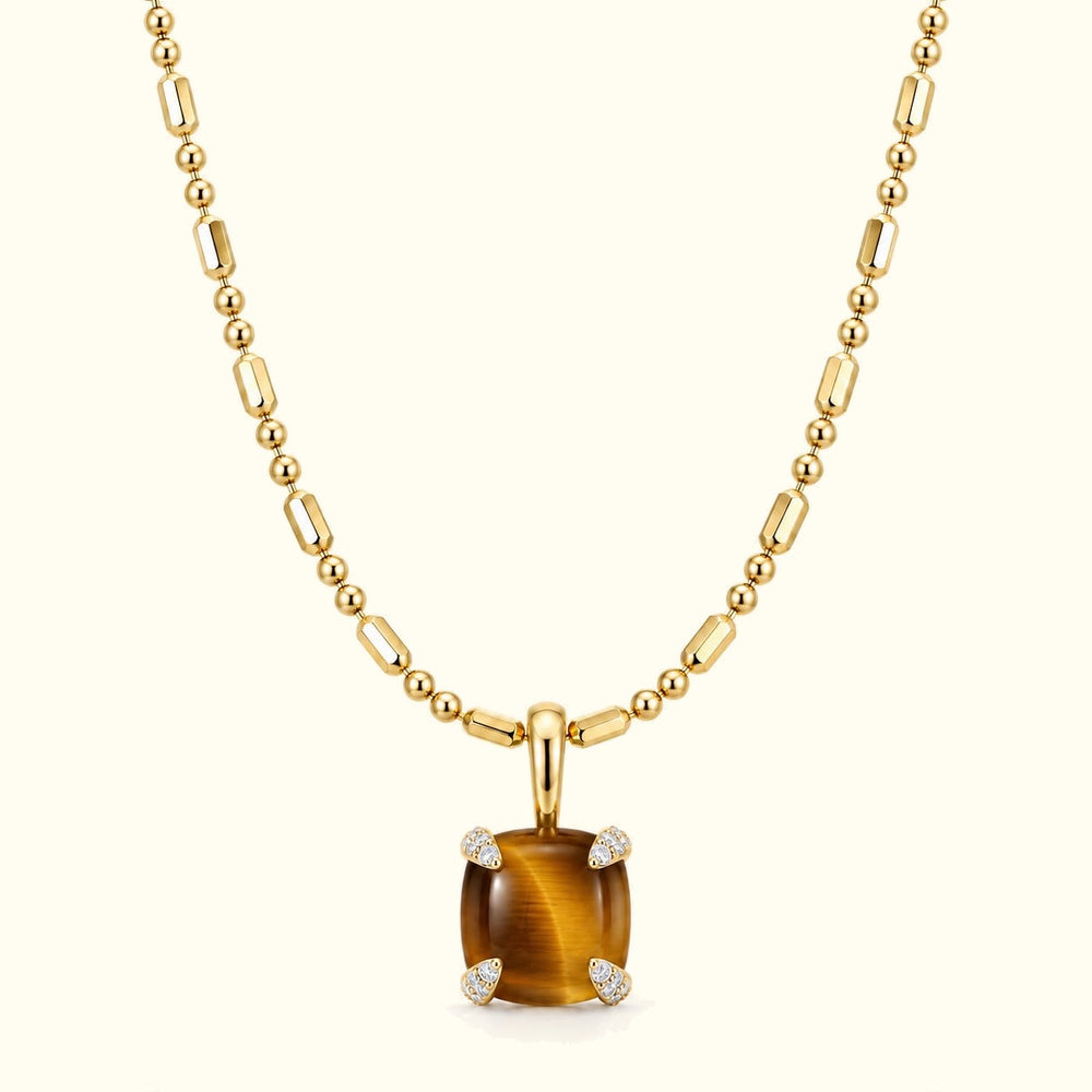 Bloom amulet necklace, a tiger's eye pendant on a 14K yellow gold ball-and-bar chain