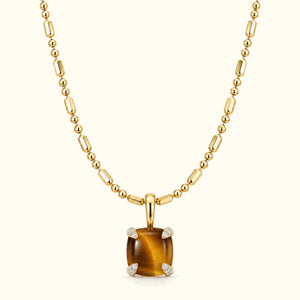 Bloom amulet necklace, a tiger's eye pendant on a 14K yellow gold ball-and-bar chain