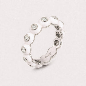 Irdoja Bubble eternity band in Blanc enamel, platinum, with bezel-set diamonds.