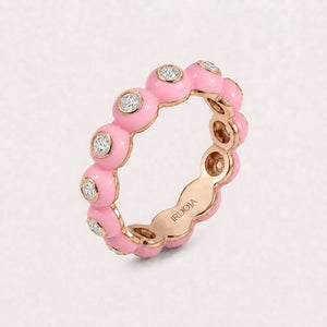 Irdoja Bubble eternity band in Bubble Pink enamel, rose gold, with bezel-set diamonds.