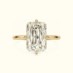 The Compass Radiant, a radiant-cut lab-grown diamond solitaire on compass prongs in 18K yellow gold
