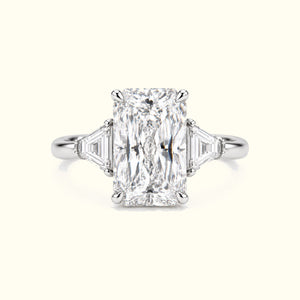 The Radiant, a radiant-cut lab-grown diamond ring with trapezoid side stones in polished platinum