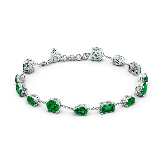 Lab-Grown Emerald Multi-Shape Bracelet 6.50 tcw featuring vibrant emerald stones in various cuts against a silver chain.