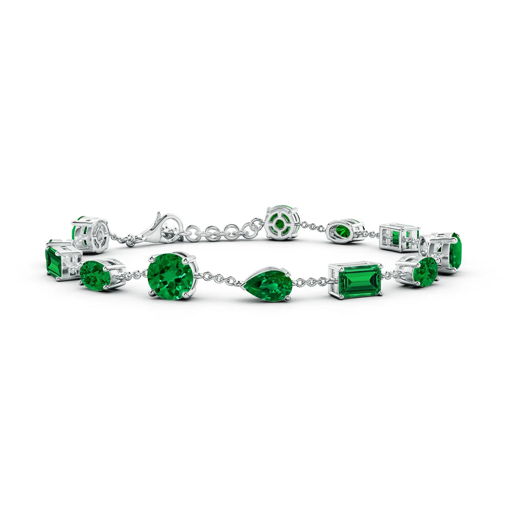 Lab-Grown Emerald Multi-Shape Bracelet 6.50 tcw featuring vibrant emerald stones in various cuts against a silver chain.