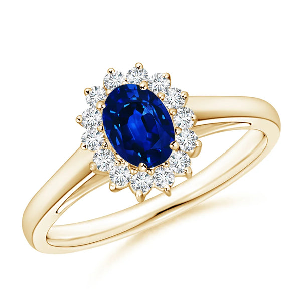 Lab-Grown Princess Diana Inspired Blue Sapphire Ring with Diamond Halo on a gold band.
